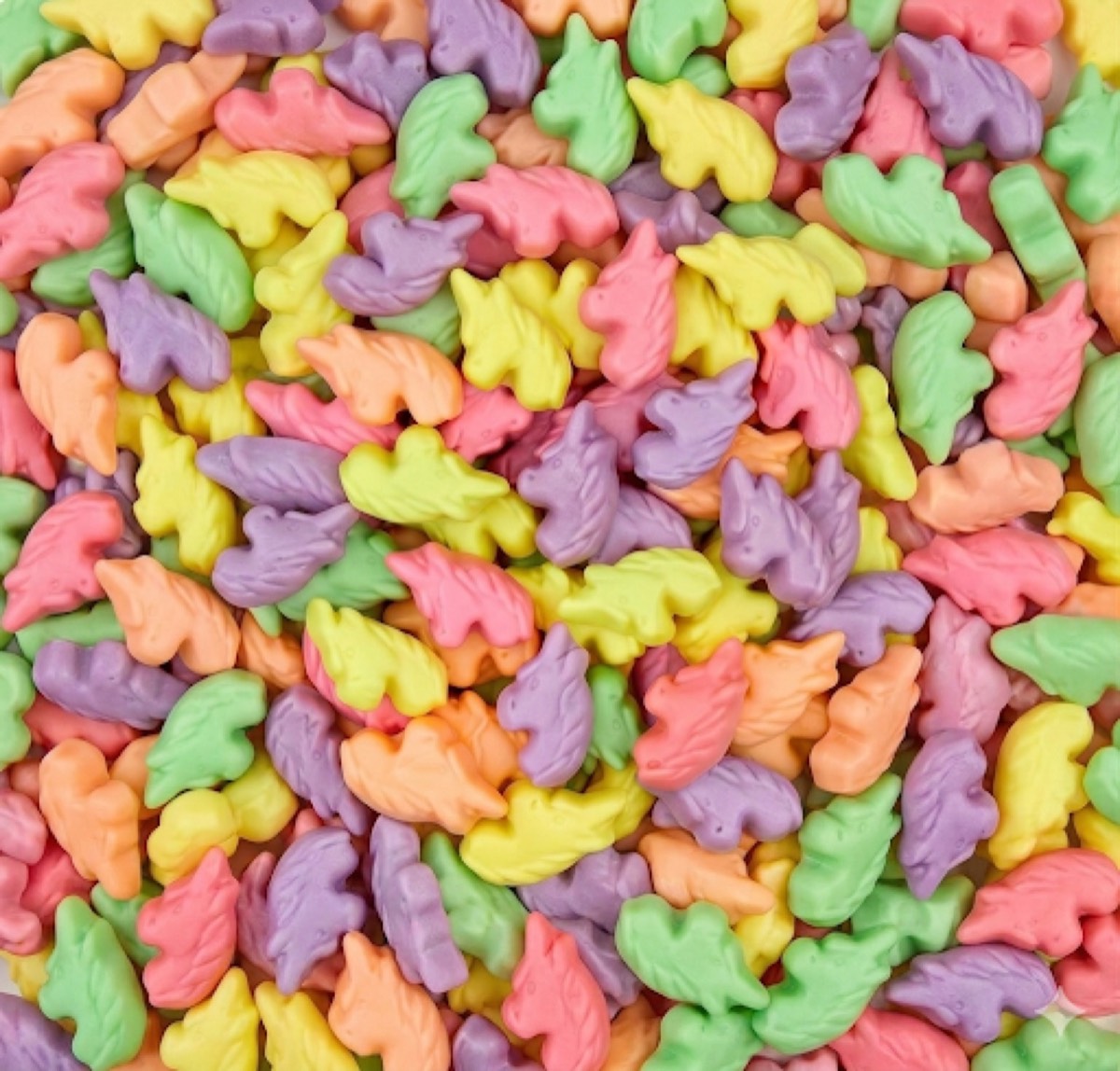 Pastel pink, purple, green, orange, and yellow unicorn-shaped Halal candies